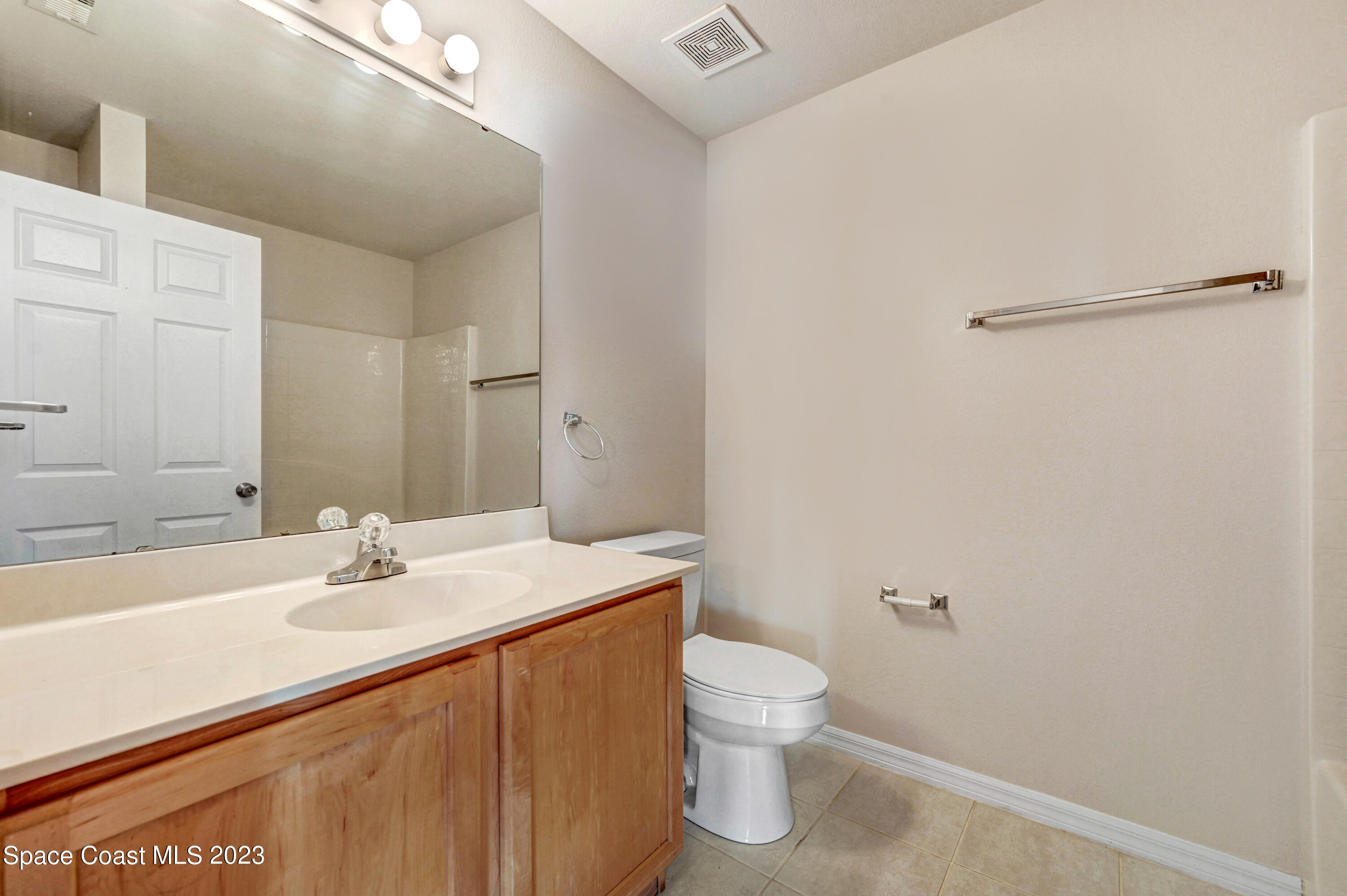 2070 Redwood Circle Palm Bay, FL 32905 - Photo 18 of 33 a bathroom with a sink toilet and vanity