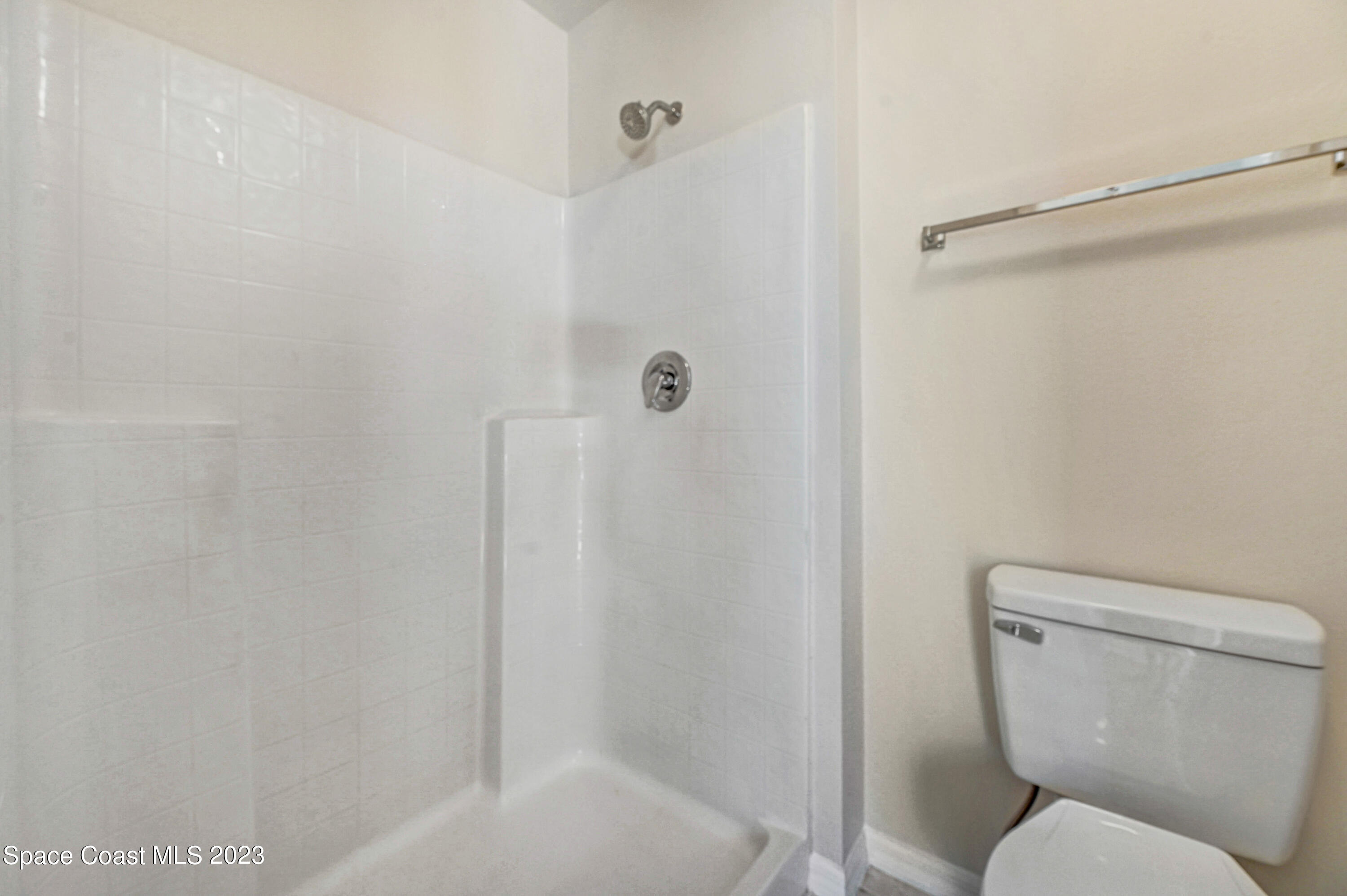 2070 Redwood Circle Palm Bay, FL 32905 - Photo 21 of 33 a bathroom with a toilet and a shower