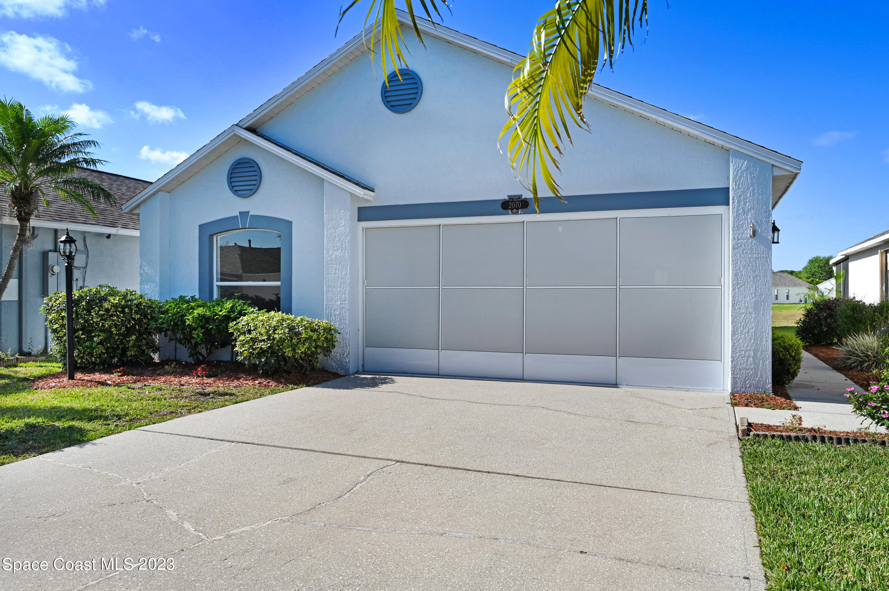 2070 Redwood Circle Palm Bay, FL 32905 - Photo 27 of 33 a house view with a garden space