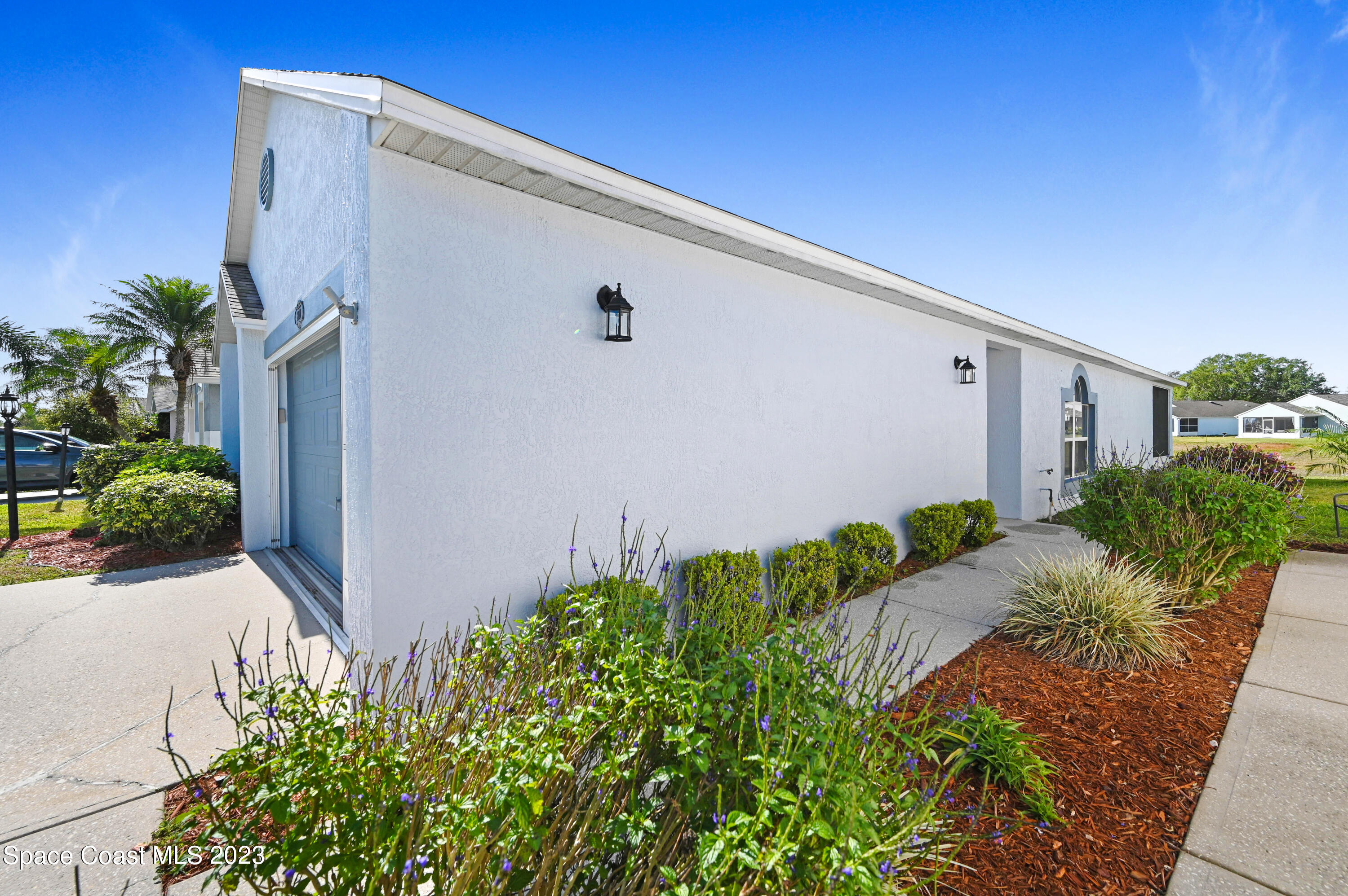 2070 Redwood Circle Palm Bay, FL 32905 - Photo 29 of 33 a backyard with potted plants