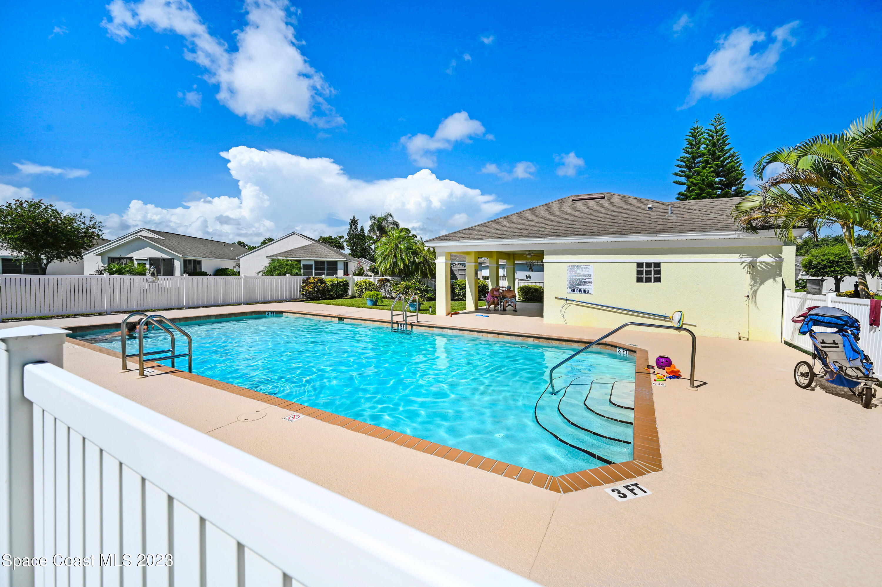 2070 Redwood Circle Palm Bay, FL 32905 - Photo 32 of 33 a view of a house with swimming pool and sitting area