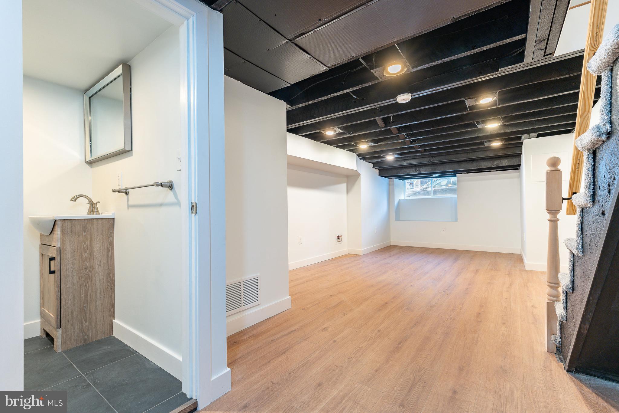 3016 South 17th Street Philadelphia, PA 19145 - Photo 20 of 30 a view of empty room with wooden floor and fan