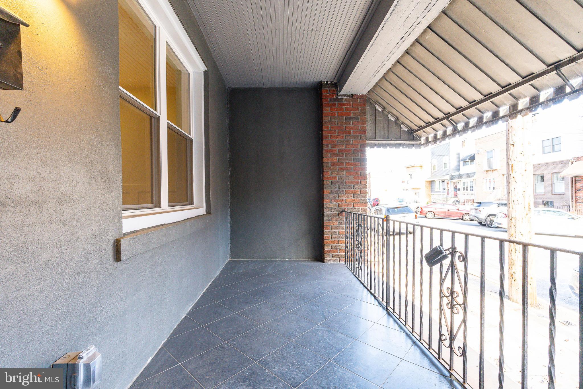 3016 South 17th Street Philadelphia, PA 19145 - Photo 26 of 30 a view of a porch with wooden floor and outdoor space