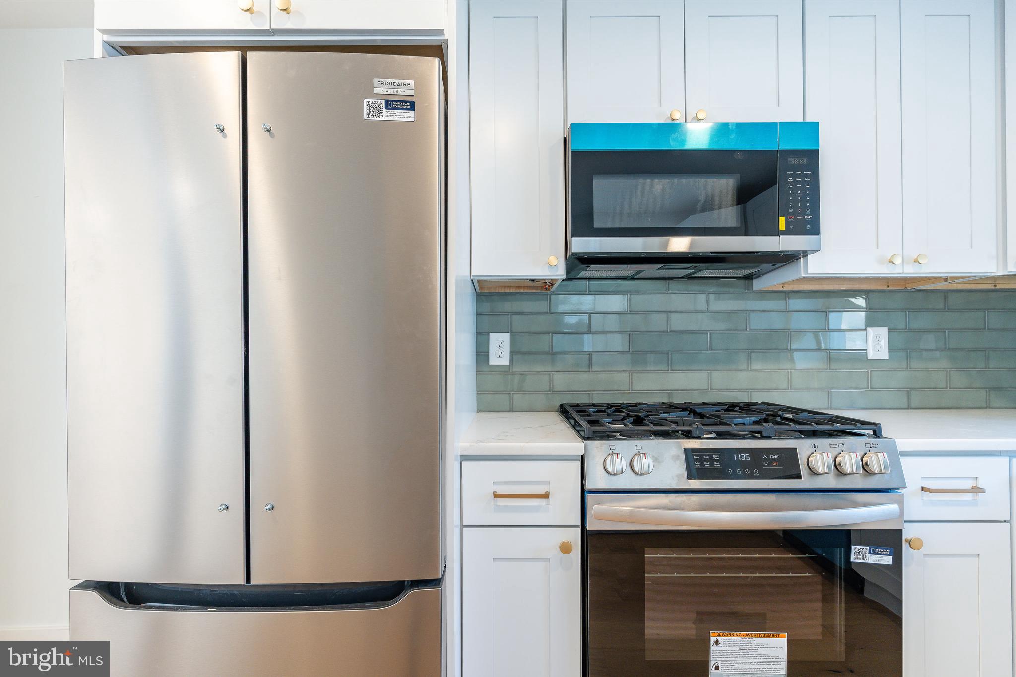 3016 South 17th Street Philadelphia, PA 19145 - Photo 7 of 30 a kitchen with a stove and a microwave