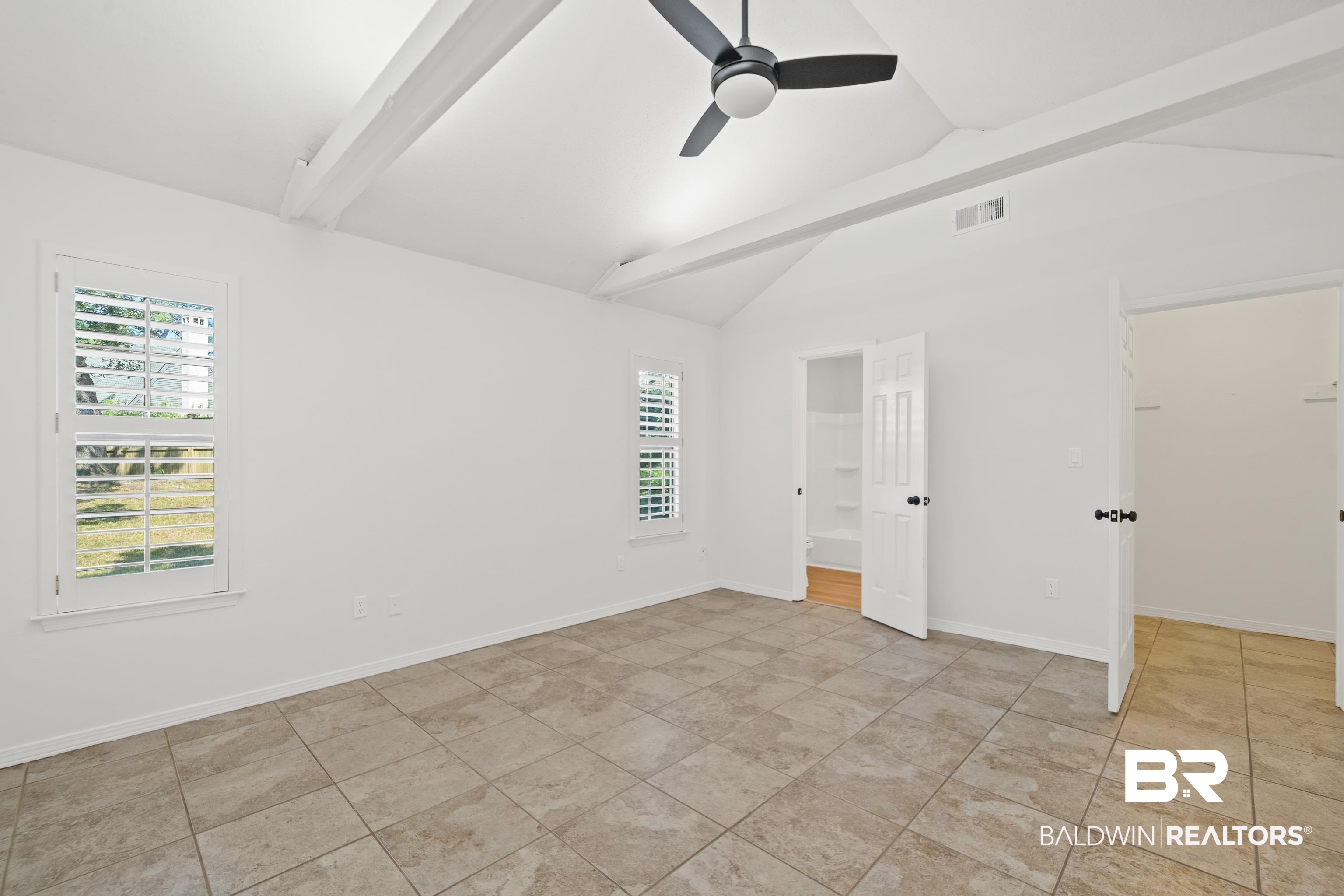 306 Liberty Street Fairhope, AL 36532 - Photo 17 of 32 Featuring large walk-in closet and ensuite.