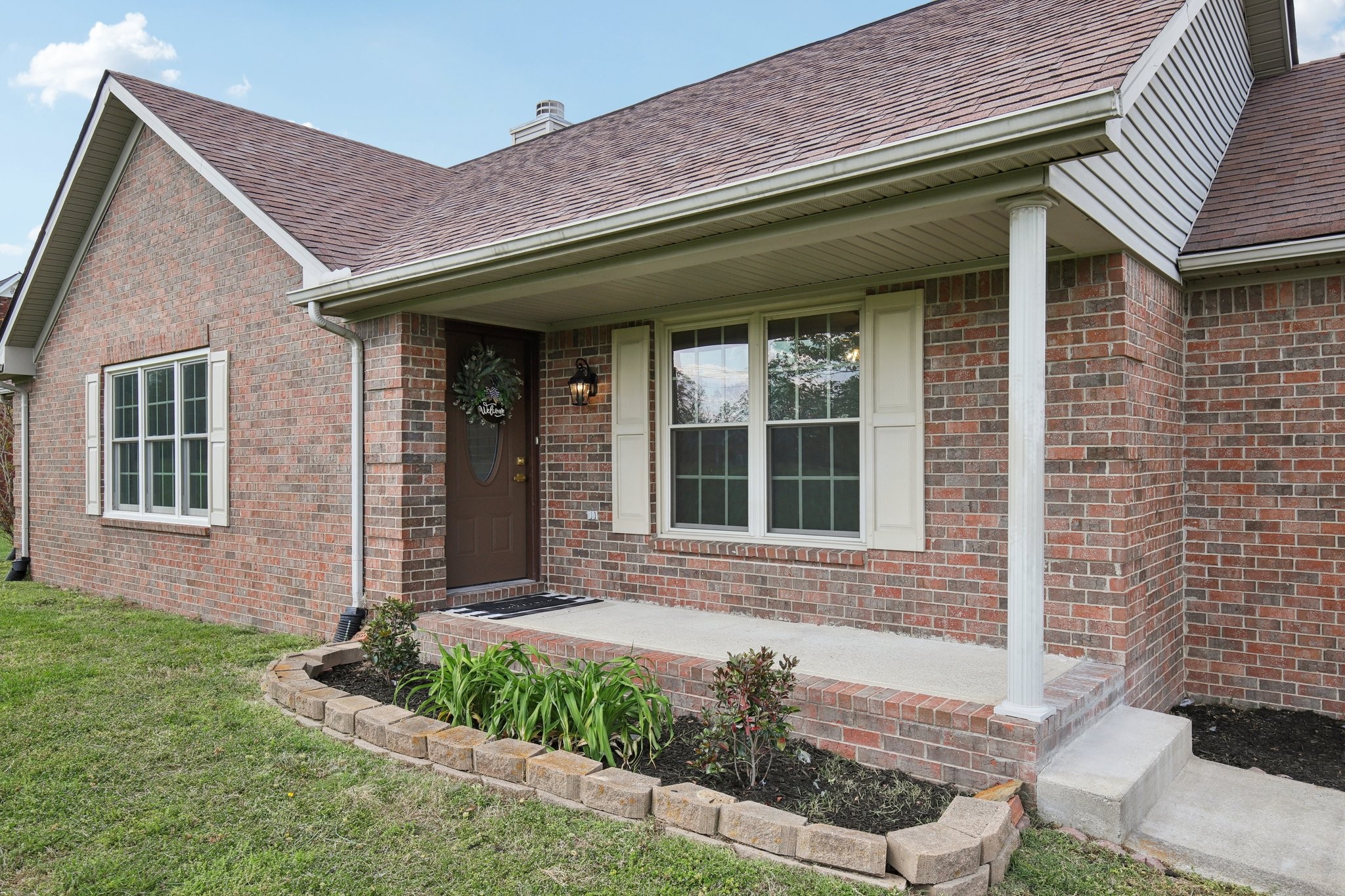 1698 Porter Road Bon Aqua, TN 37025 - Photo 2 of 24 a front view of a house with a yard