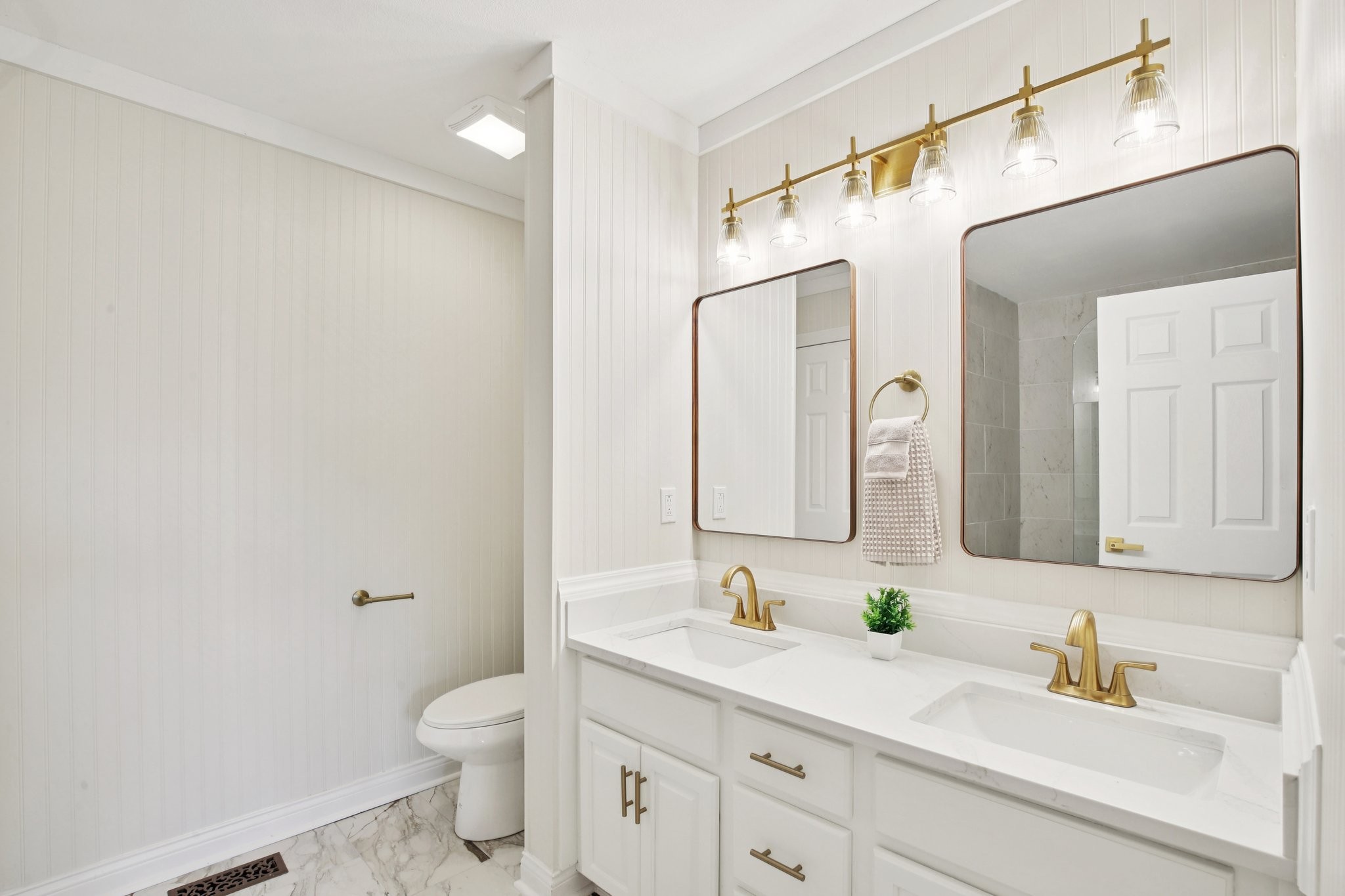 1698 Porter Road Bon Aqua, TN 37025 - Photo 9 of 24 a bathroom with a granite countertop sink a toilet and a mirror