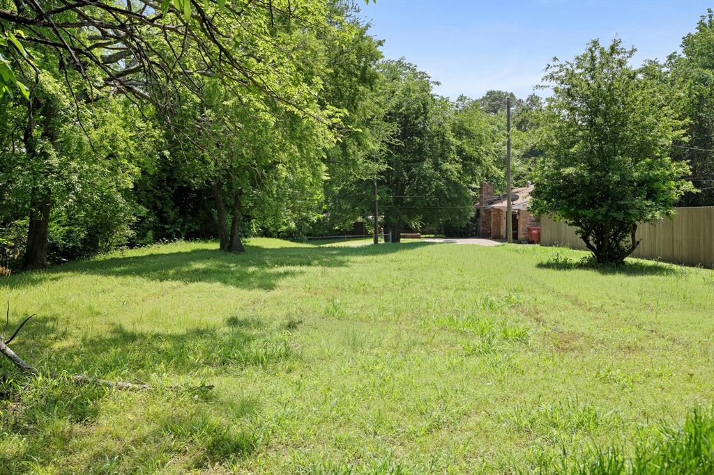 602 Wes Michael Road Bonham, TX 75418 - Photo 14 of 16 a view of green field with trees in the background