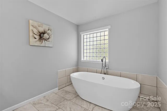 a bathroom with a sink a toilet and a bathtub