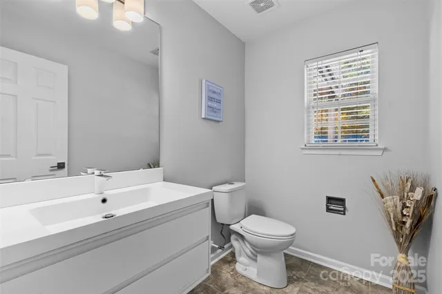 a view of a porch with furniture and a yard