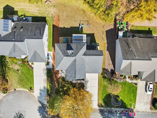 an aerial view of residential houses with outdoor space