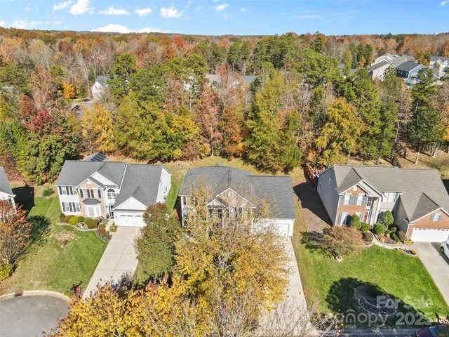 a view of a brick house with a large windows