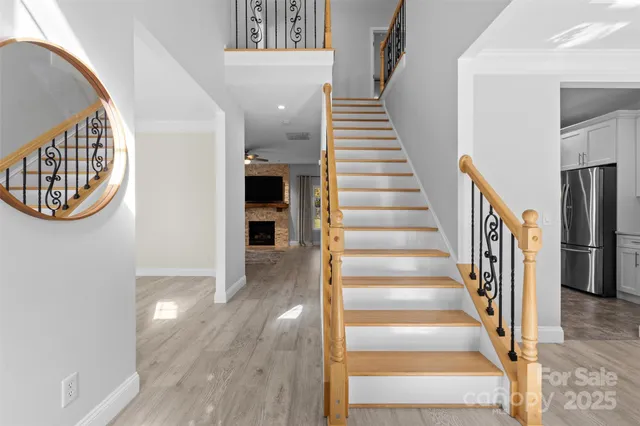 a dining room with furniture and chandelier