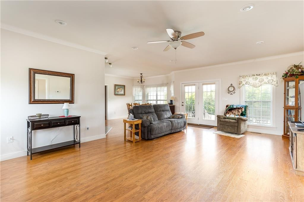1008 Guerrant Springs Road Ruffin, NC 27326 - Photo 12 of 32 a living room with furniture and a wooden floor