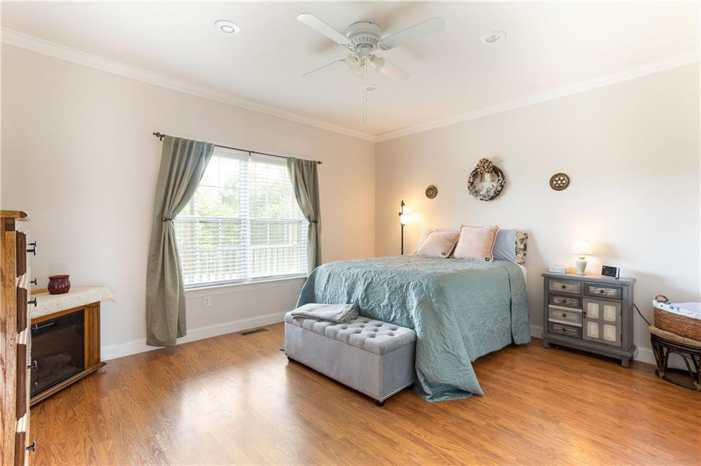 1008 Guerrant Springs Road Ruffin, NC 27326 - Photo 15 of 32 a bedroom with a bed furniture and a window