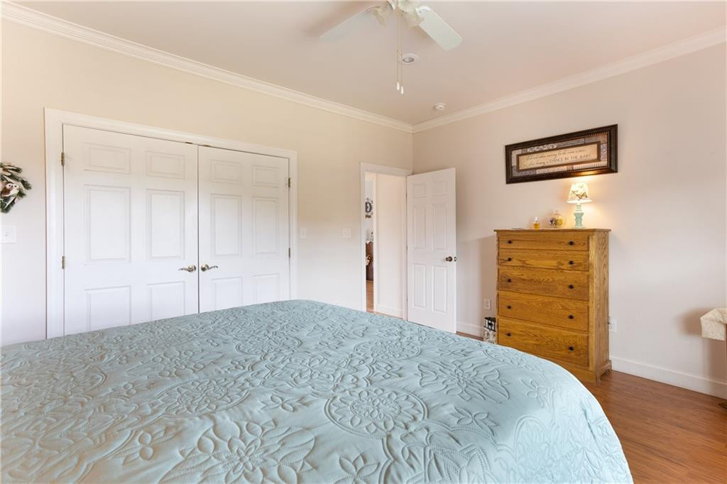 1008 Guerrant Springs Road Ruffin, NC 27326 - Photo 16 of 32 a bedroom with a bed and a dresser