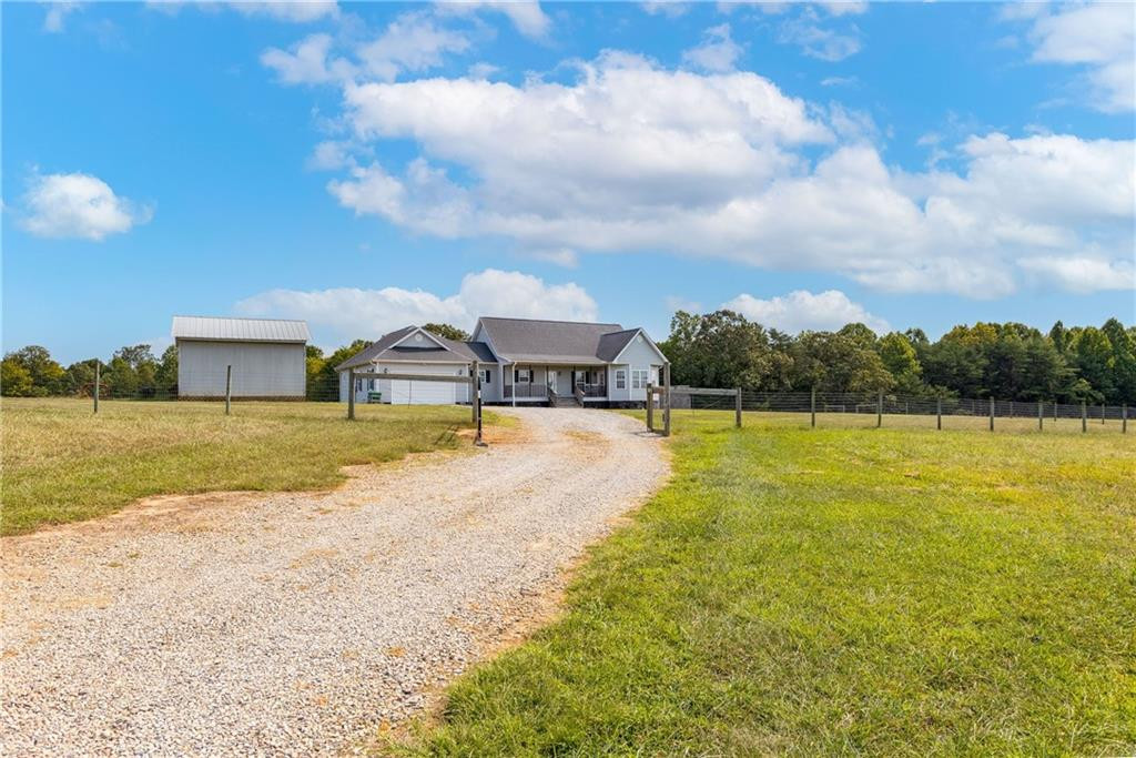 1008 Guerrant Springs Road Ruffin, NC 27326 - Photo 32 of 32 a view of a house with a yard