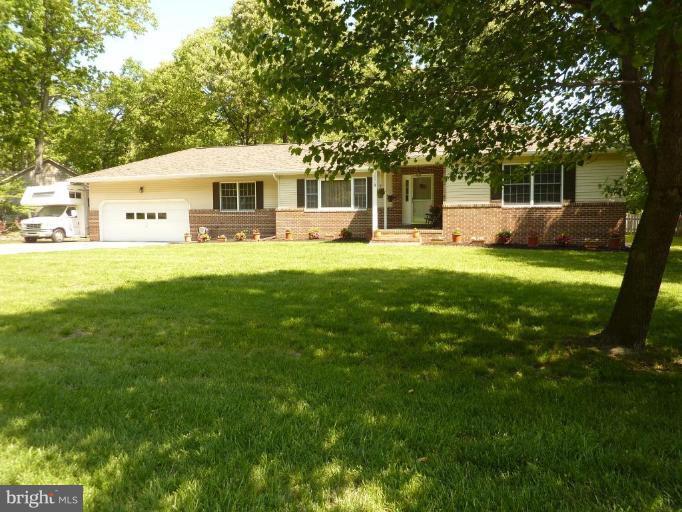 Updated rancher on .57 acres; mature trees