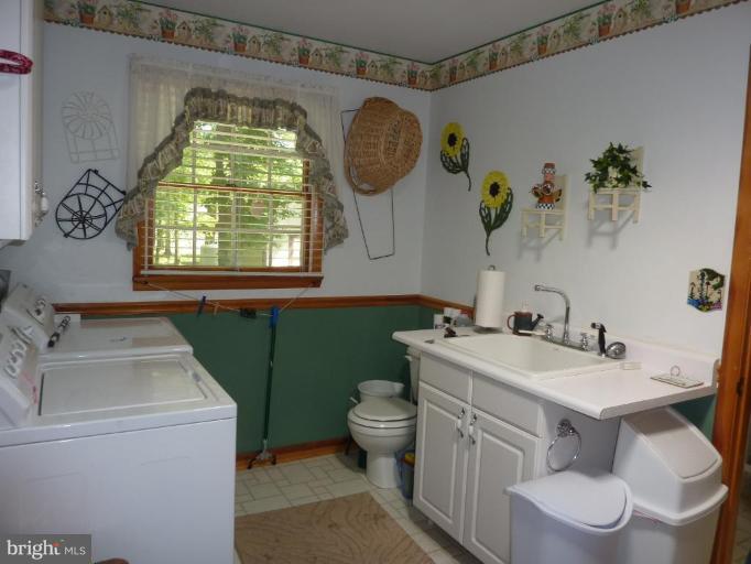 7889 Poplar Grove Road Severn, MD 21144 - Photo 9 of 20 Huge laundry room just off kitchen