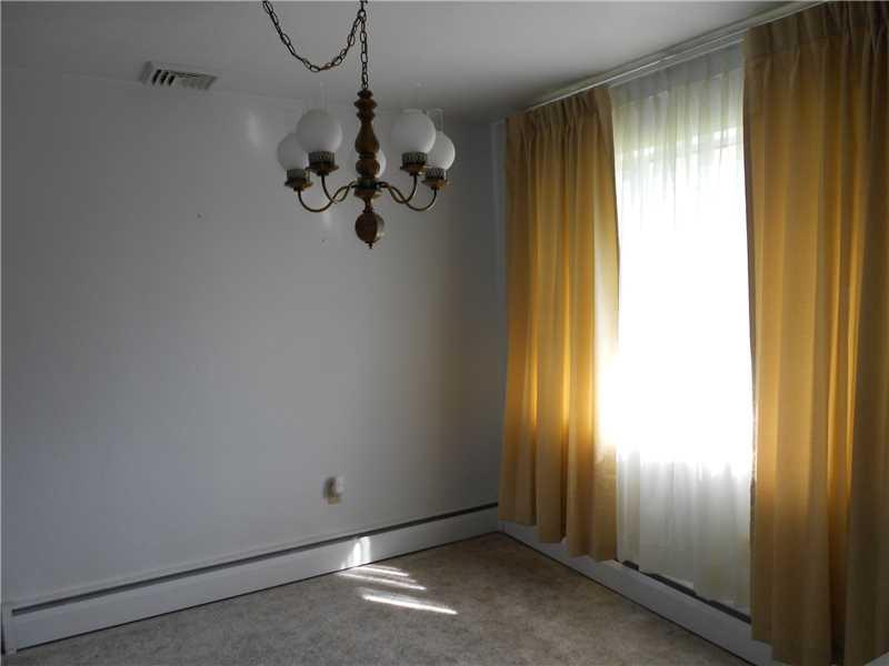 Dining Room. Just off the kitchen is the dining room with newer neutral carpeting.