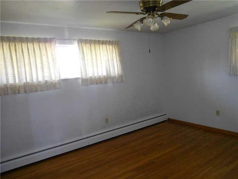 Master Bedroom. All three bedrooms boast hardwood floors and ceiling fans. Master also has a walk-in closet and half bath.