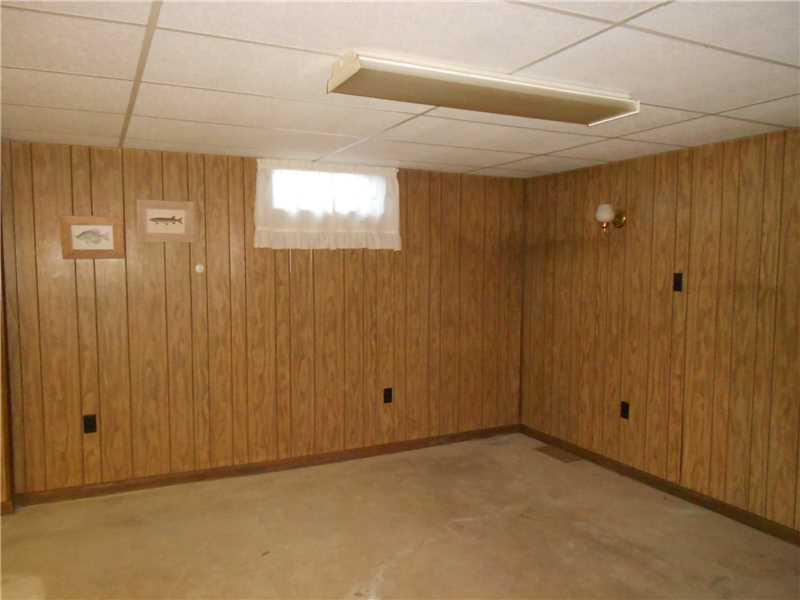 Den/Family/Great Room. Lower lever is quite spacious and ready for some carpeting.