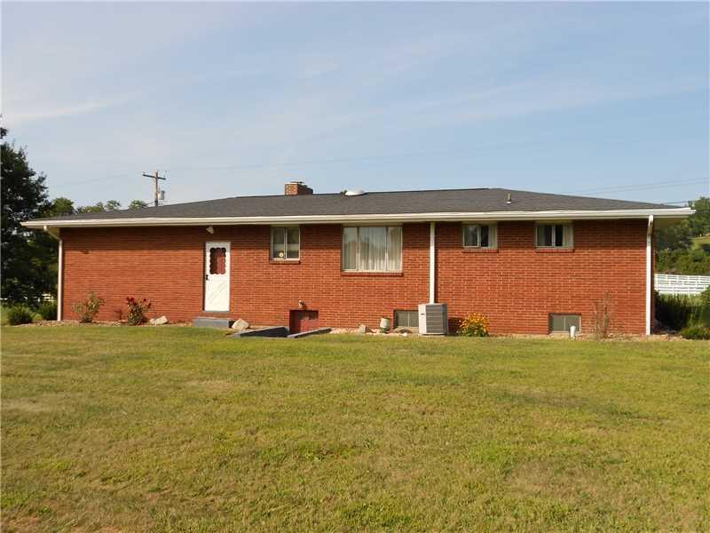 Exterior Back. Large level corner lot.