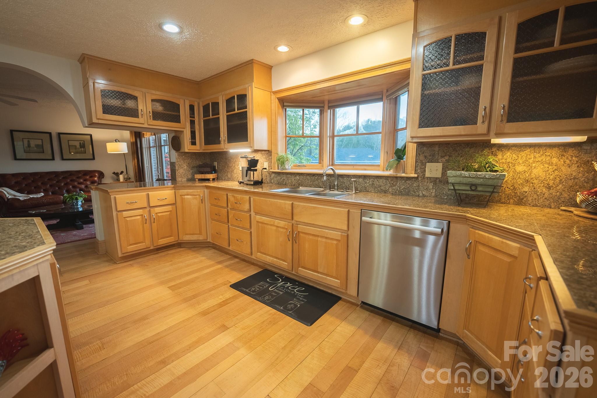 6985 Junaluska Road Boone, NC 28607 - Photo 28 of 35 a kitchen with stainless steel appliances granite countertop a sink and cabinets