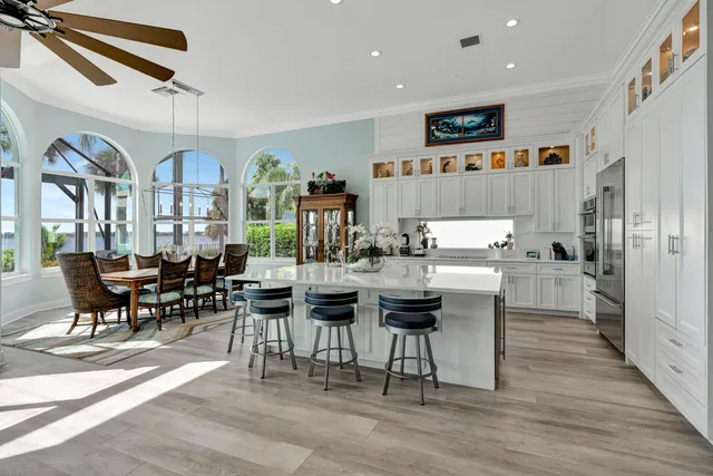 a living room filled with furniture and a floor to ceiling window
