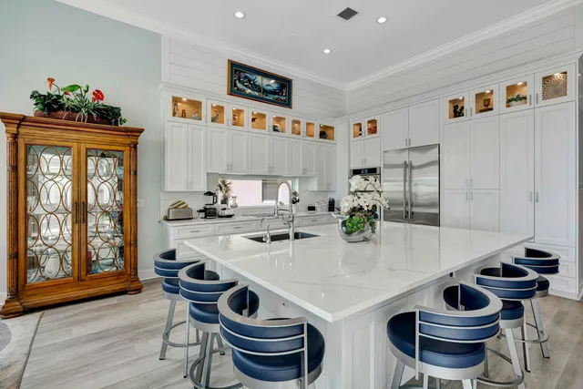 a living room with furniture a flat screen tv and a window