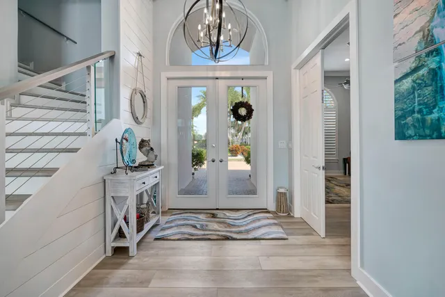 a spacious bedroom with a large bed and a flat screen tv