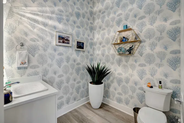 a en suite bathroom with a granite countertop sink mirror and shower