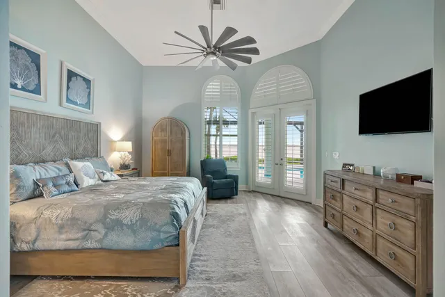 a en suite bathroom with a double vanity sink a mirror and a shower