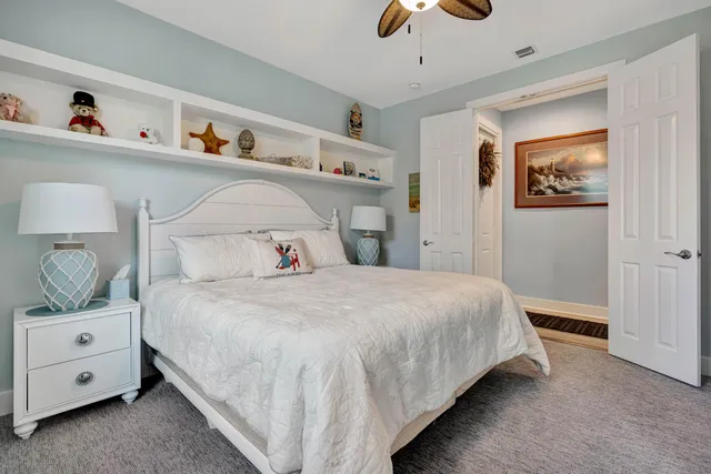 a front view of a house with a yard and a garden