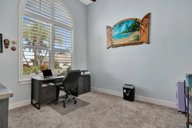an aerial view of a house with a garden and plants