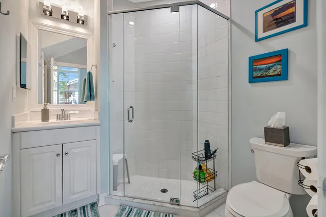 an aerial view of multiple houses with yard