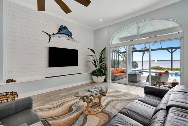 a kitchen with stainless steel appliances granite countertop a sink a stove and refrigerator