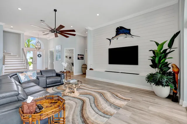 a kitchen with a stove and wooden floor