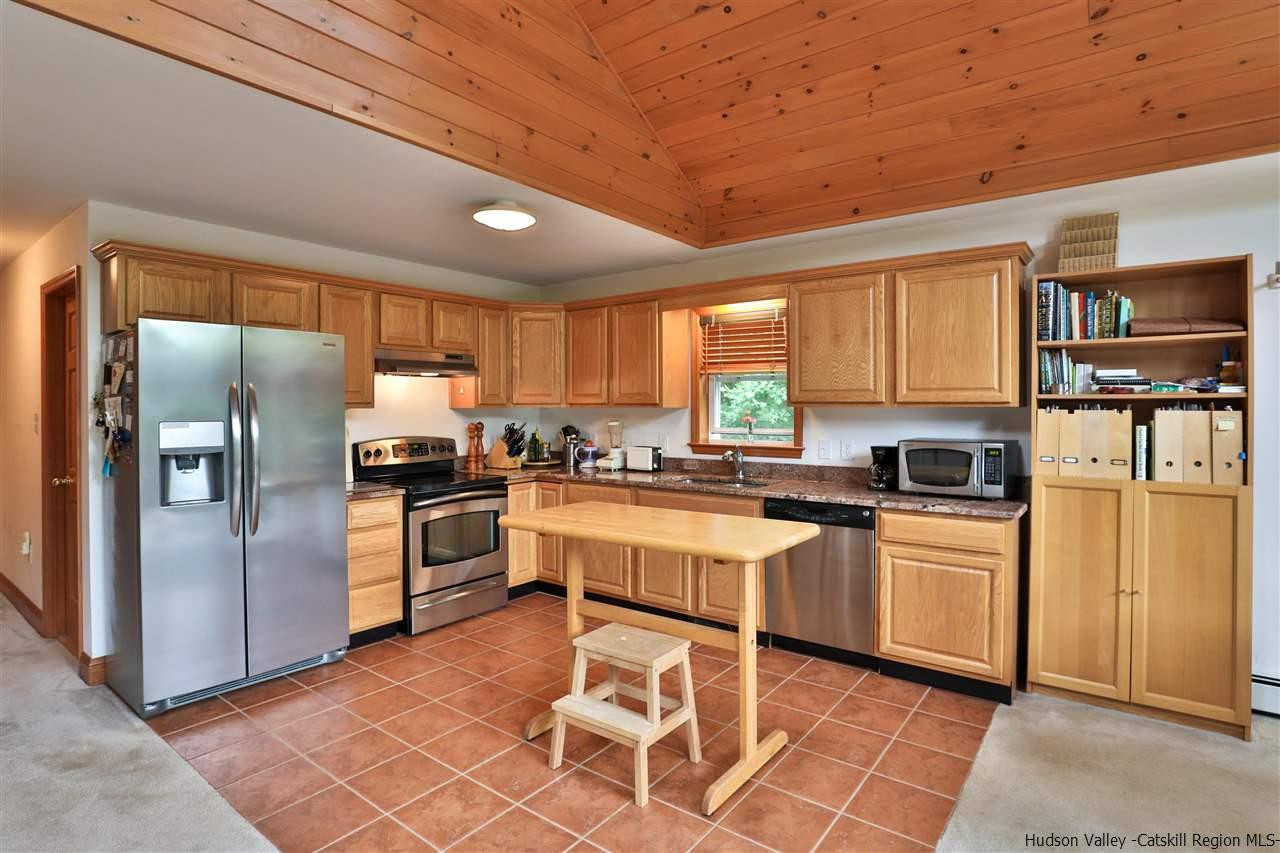 293 Barley Road Pine Hill, NY 12465 - Photo 11 of 25 a kitchen with cabinets stainless steel appliances and a window