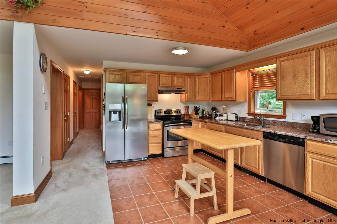 293 Barley Road Pine Hill, NY 12465 - Photo 15 of 25 a kitchen with stainless steel appliances granite countertop a refrigerator a sink a stove and cabinets