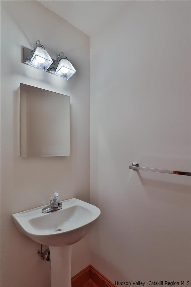 293 Barley Road Pine Hill, NY 12465 - Photo 22 of 25 a bathroom with a sink and mirror