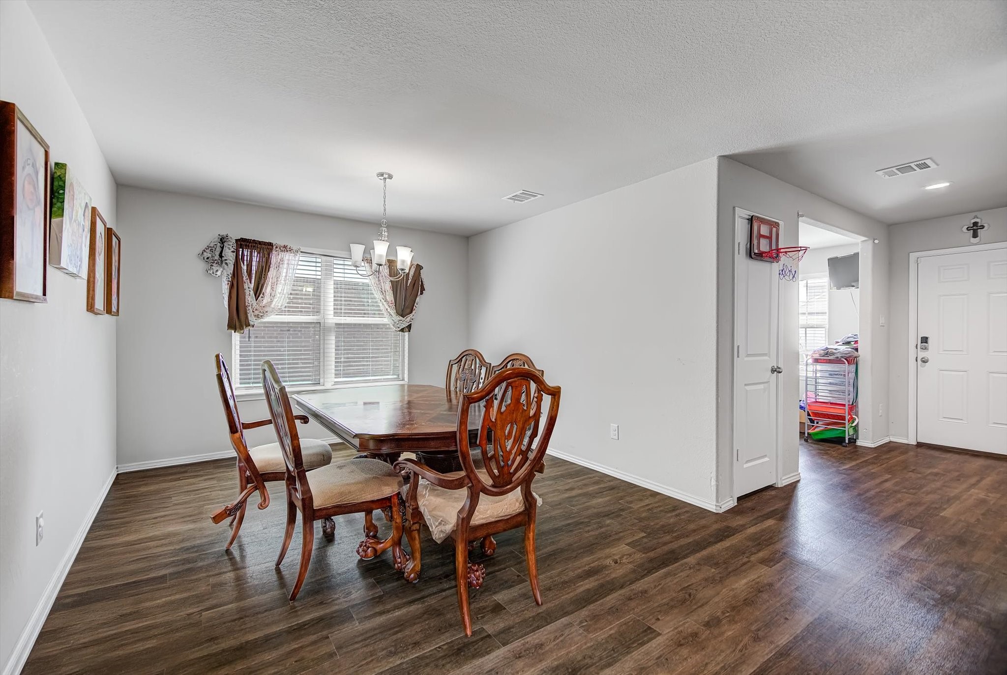 1230 Baja Vista Way Channelview, TX 77530 - Photo 14 of 33 a view of a dining room with furniture and wooden floor