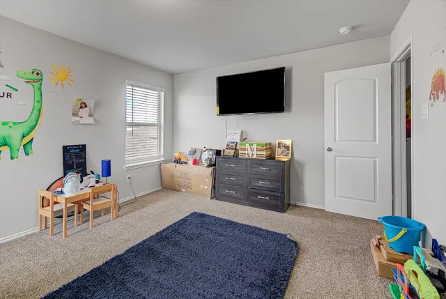 a room with furniture and a flat screen tv