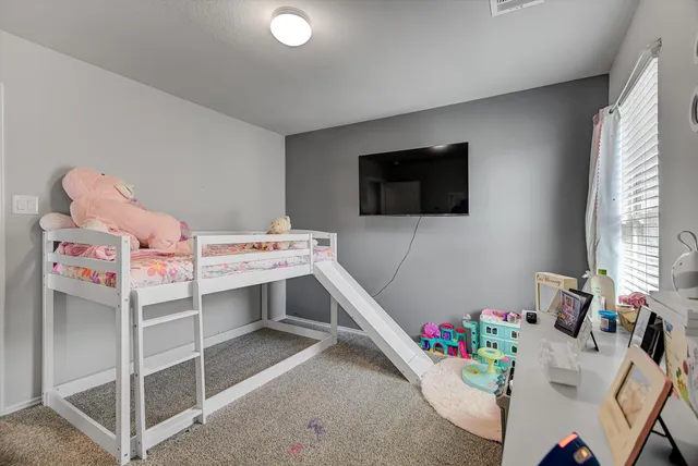 a bedroom with a bed and closet