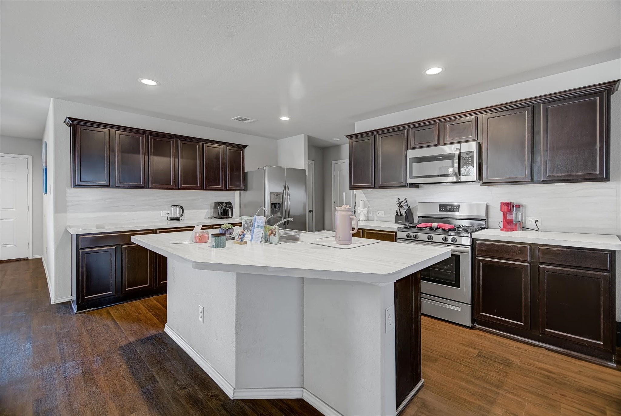 1230 Baja Vista Way Channelview, TX 77530 - Photo 10 of 33 a kitchen with stainless steel appliances granite countertop a sink stove and refrigerator