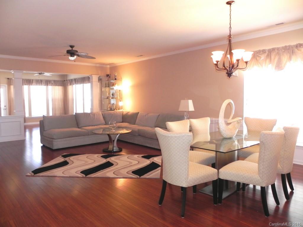 3030 Voyageurs Way Indian Land, SC 29707 - Photo 7 of 12 a view of a dining room with furniture window and wooden floor