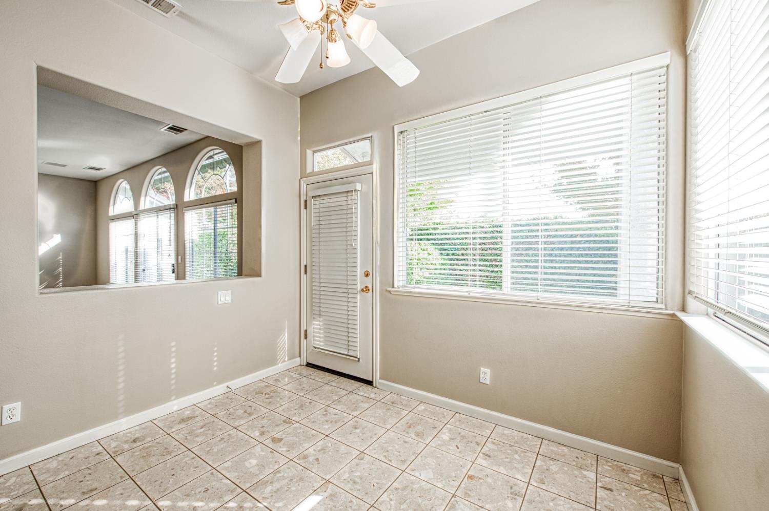 2140 West Rue St Michel Fresno, CA 93711 - Photo 27 of 36 a view of an empty room with a window