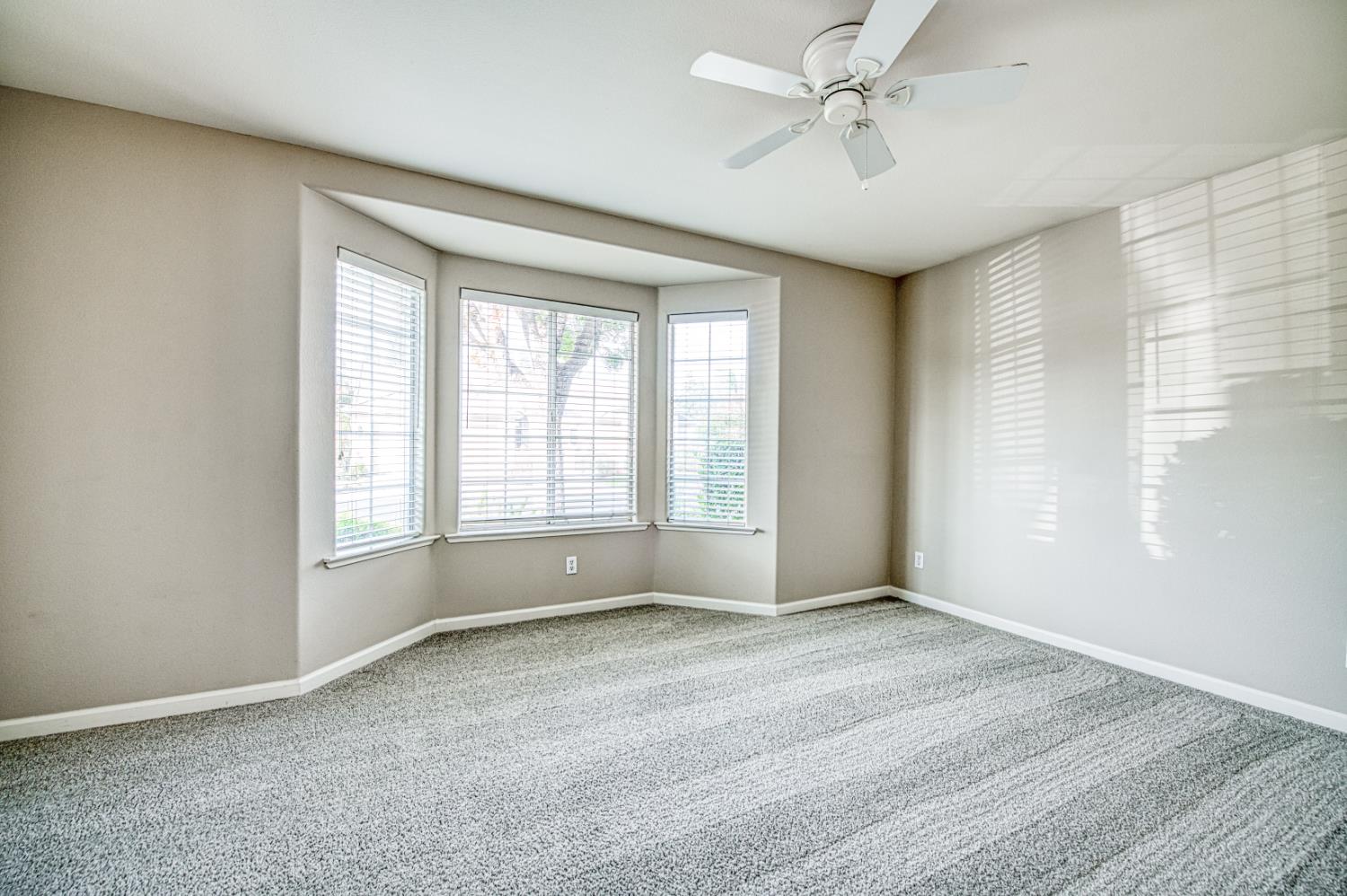 2140 West Rue St Michel Fresno, CA 93711 - Photo 30 of 36 a view of an empty room with a window