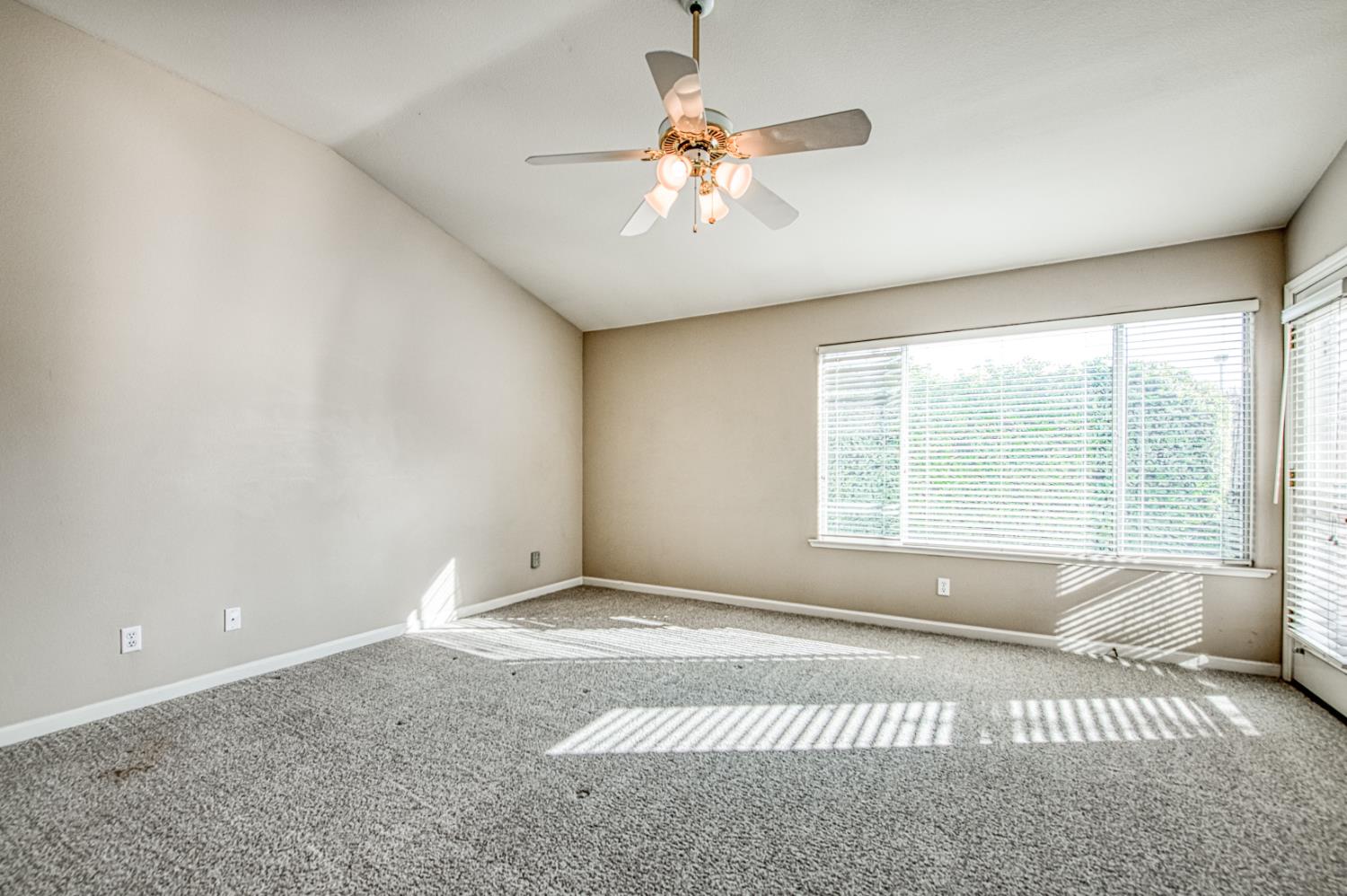 2140 West Rue St Michel Fresno, CA 93711 - Photo 32 of 36 a view of an empty room with a window