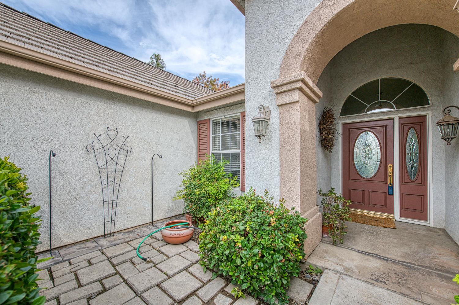 2140 West Rue St Michel Fresno, CA 93711 - Photo 5 of 36 a front view of a house with garden